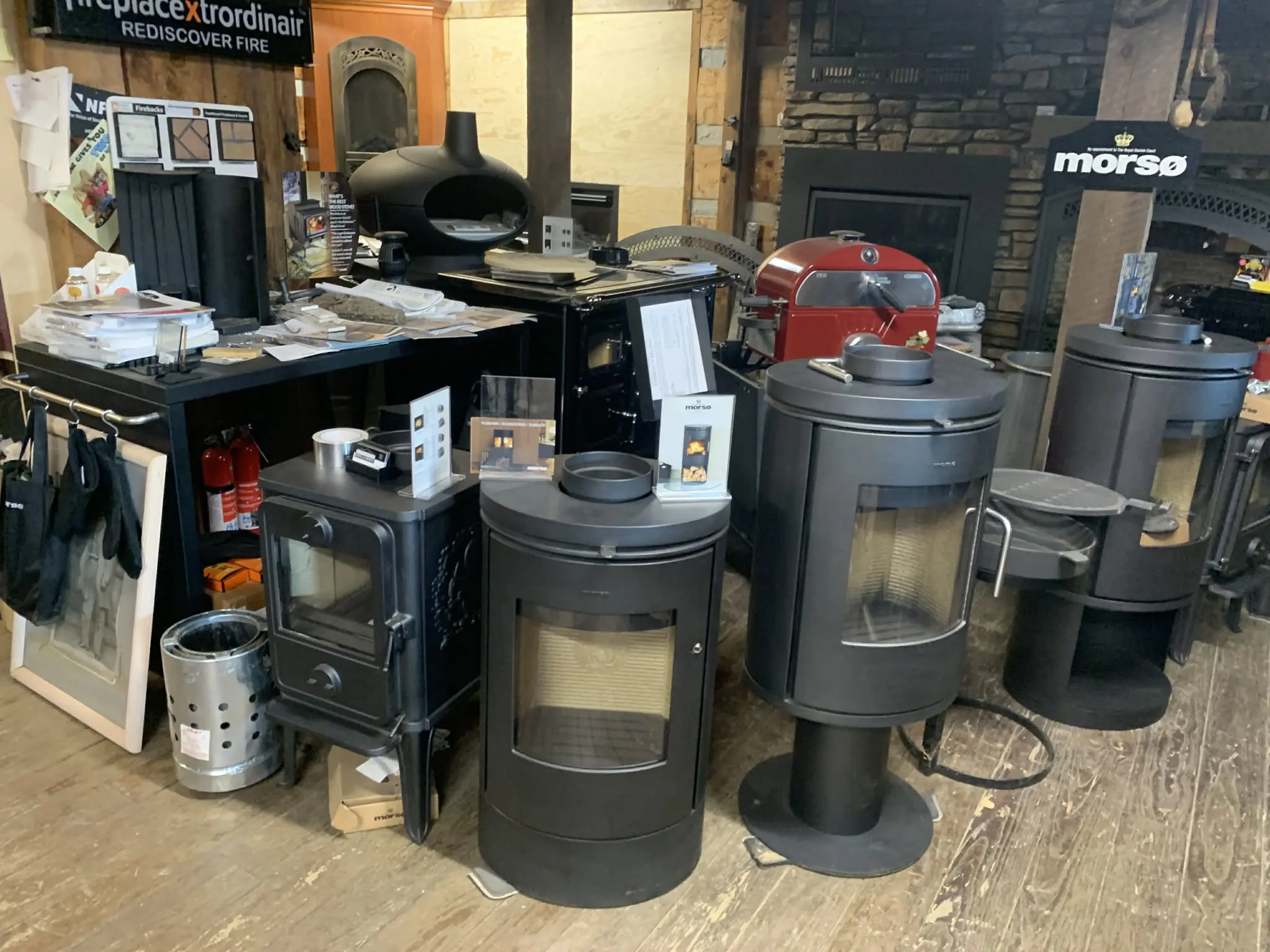 Black freestanding wood stoves in showroom