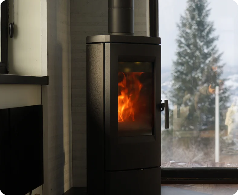 Modern wood stove with fire burning