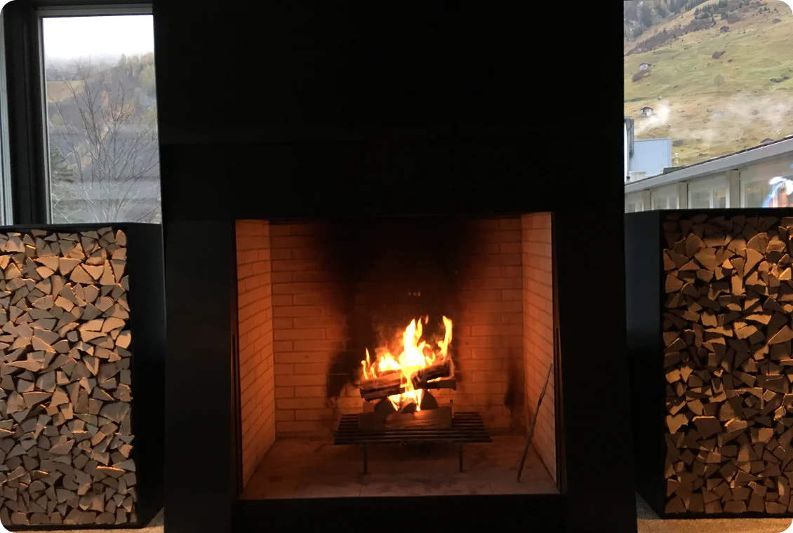 Warm fire burning in modern hearth